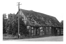 A house connected with a barn and a cowshed