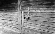 A window in a log structure barn