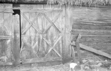 A fragment of a post-and-plank barns wall