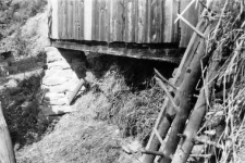 A corner foundation of a pole barn