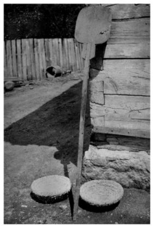 A bread oven shovel and a straw basket