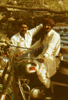 Portrait of two man with motorcycle (Iconographic document)