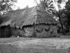 A barn with a plaiting walls