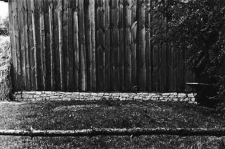 A stone foundation by the new barn