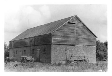 A brick barn with a knee wall