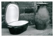 A cast iron baking pot and a clay jug