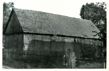 A half post-and-plank barn