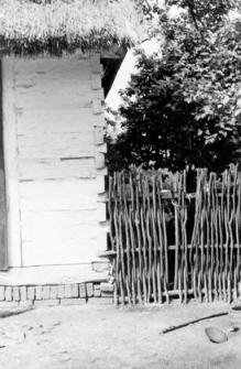 A fragment of a cottage, a fence